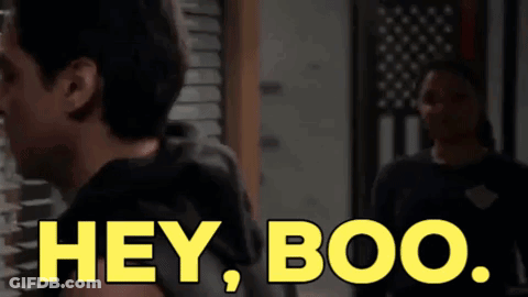 Woman Standing In Front Of American Flag Saying Hey Boo GIF
