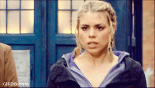Woman Standing In Front Of Blue Door Serious GIF