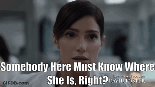 Woman Standing In Front Of Bookshelf With Ad GIF