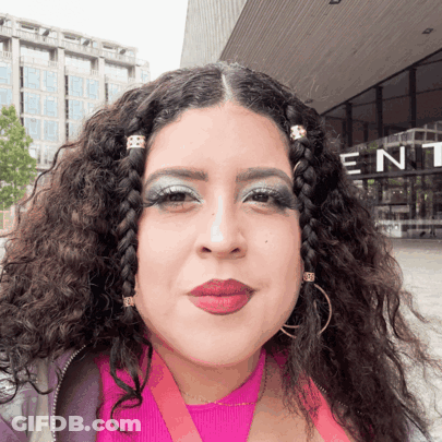 Woman Standing In Front Of Building Saying Ent GIF