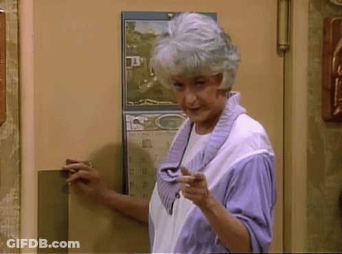 Woman Standing In Front Of Calendar Saying G GIF