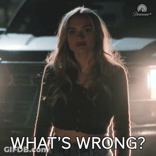 Woman Standing In Front Of Car Saying What's Wrong GIF