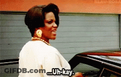 Woman Standing In Front Of Car Says Uh-Kay GIF