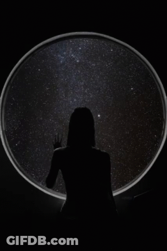 Woman Standing In Front Of Circle Of Stars GIF