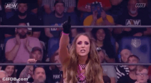 Woman Standing In Front Of Crowd At Wrestling Event GIF