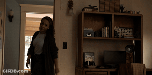 Woman Standing In Front Of Desk With Box GIF