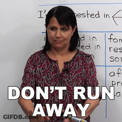 Woman Standing In Front Of Do Not Run Away Whiteboard GIF