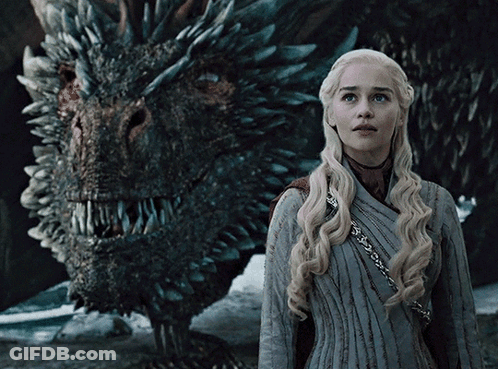 Woman Standing In Front Of Dragon With Sharp Teeth GIF