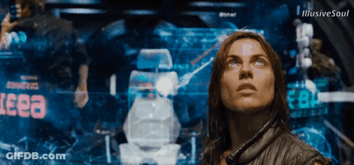 Woman Standing In Front Of Eeea Screen GIF