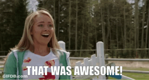 Woman Standing In Front Of Fence Saying That Was Awesome GIF