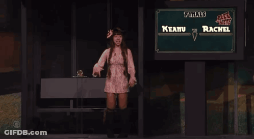 Woman Standing In Front Of Finals Sign GIF