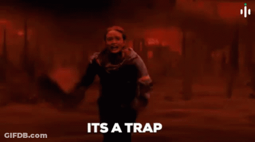 Woman Standing In Front Of Fire Saying It's A Trap GIF