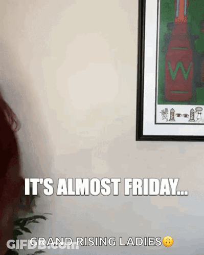 Woman Standing In Front Of Framed Picture Saying It's Almost Friday GIF