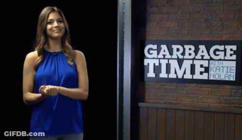 Woman Standing In Front Of Garbage Time Sign GIF