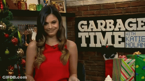 Woman Standing In Front Of Garbage Time Sign GIF