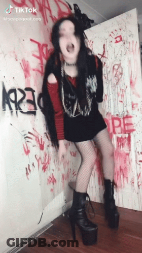 Woman Standing In Front Of Graffiti Wall 1923 GIF