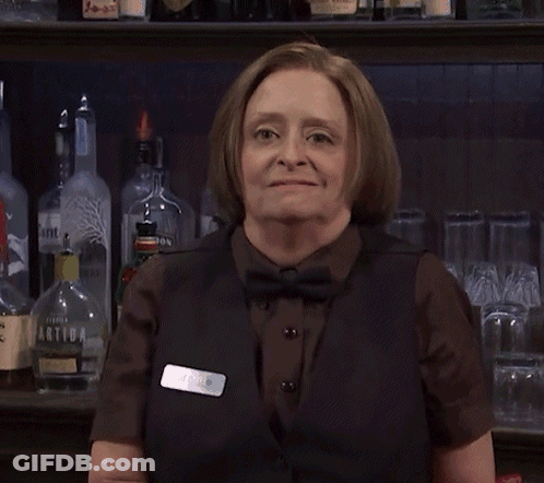 Woman Standing In Front Of Green Door GIF