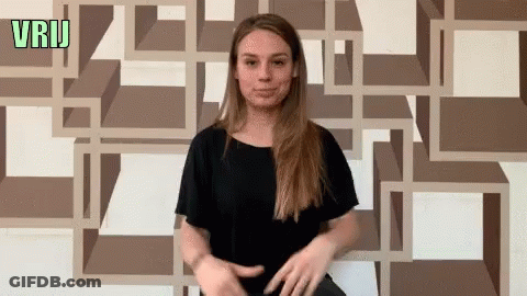 Woman Standing In Front Of Green Vrij Wall GIF