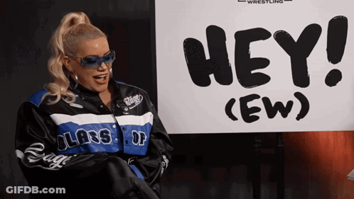 Woman Standing In Front Of Hey Sign GIF