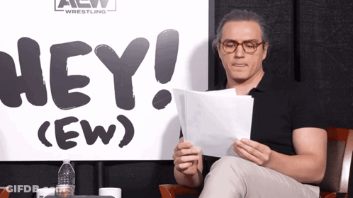 Woman Standing In Front Of Hey Sign GIF
