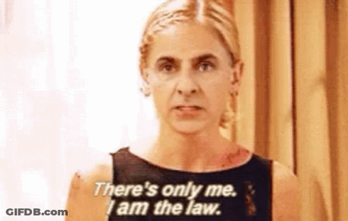 Woman Standing In Front Of How To Give Money Chalkboard GIF