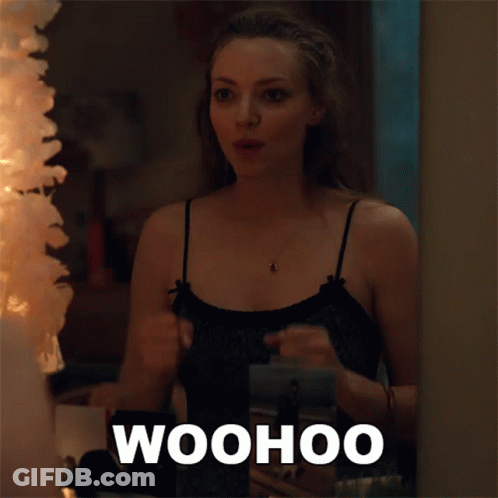 Woman Standing In Front Of Mirror Saying Woohoo GIF