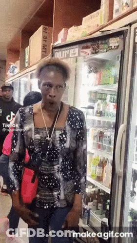 Woman Standing In Front Of Mojito Fridge GIF