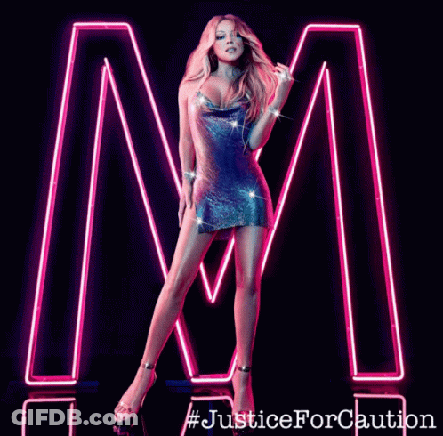Woman Standing In Front Of Neon Letter M GIF