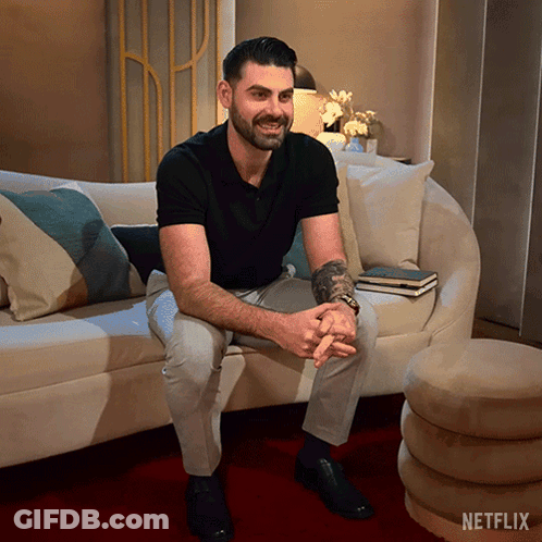 Woman Standing In Front Of Netflix Logo GIF