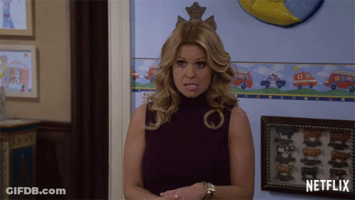Woman Standing In Front Of Netflix Wall GIF