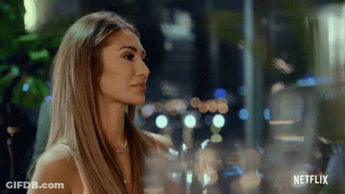 Woman Standing In Front Of Netflix Window GIF