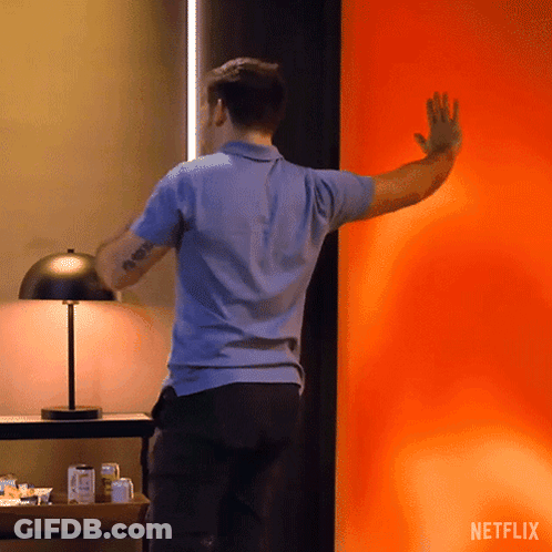 Woman Standing In Front Of Netflix Window GIF