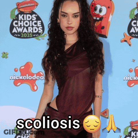 Woman Standing In Front Of Nickelodeon GIF