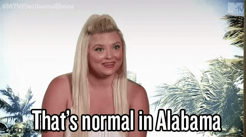 Woman Standing In Front Of Palm Trees Saying That's Normal In Alabama GIF