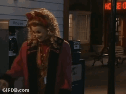 Woman Standing In Front Of Phone Booth GIF