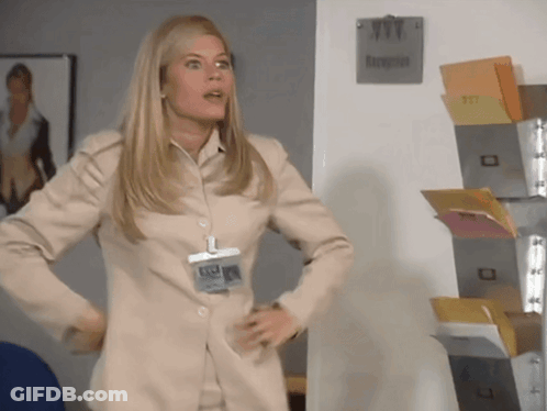 Woman Standing In Front Of Reception Sign GIF