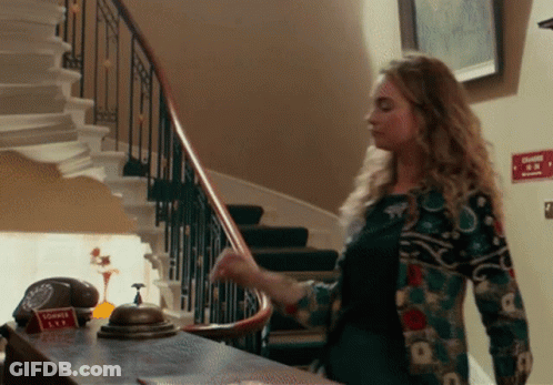Woman Standing In Front Of Shower Tea Sign GIF