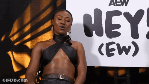 Woman Standing In Front Of Sign Saying Hey (Ew) GIF