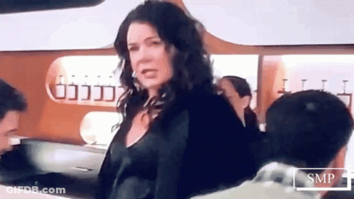 Woman Standing In Front Of SMP Sign GIF