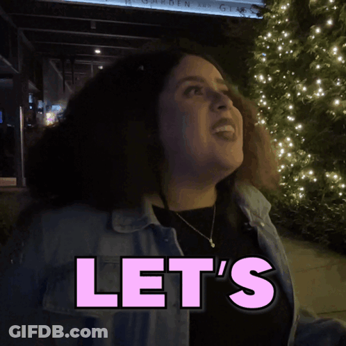 Woman Standing In Front Of Some Sign GIF