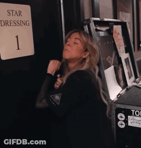 Woman Standing In Front Of Star Dressing Sign GIF