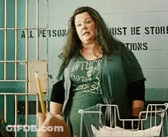 Woman Standing In Front Of Store Sign GIF