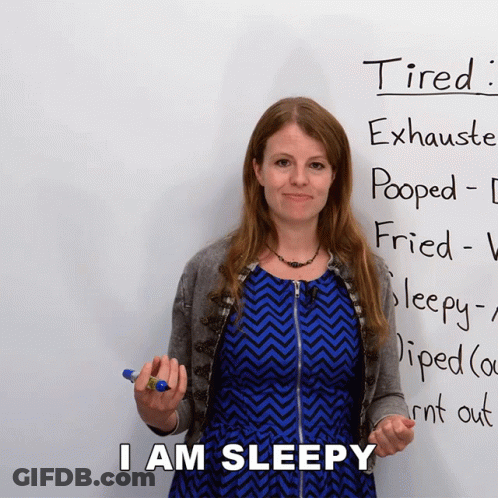 Woman Standing In Front Of Tired Sign GIF