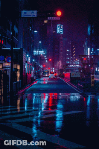 Woman Standing In Front Of Tokyo Sign GIF