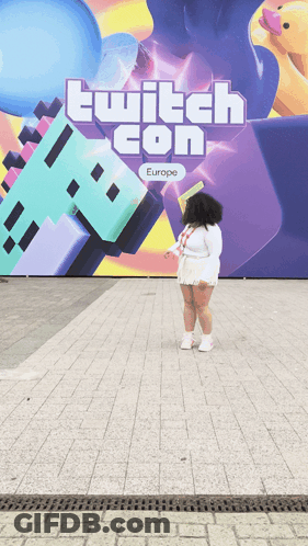 Woman Standing In Front Of Twitch Con Europe Sign GIF
