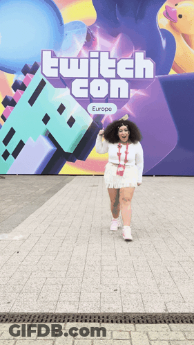 Woman Standing In Front Of Twitch Con Europe Sign GIF