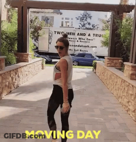 Woman Standing In Front Of Two Men And A Truck GIF
