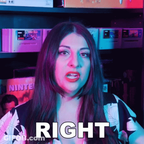 Woman Standing In Front Of Video Games Shelf GIF