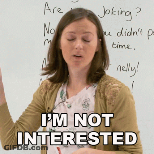 Woman Standing In Front Of Whiteboard Saying I'm Not Interested GIF