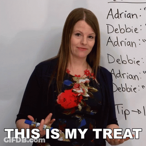 Woman Standing In Front Of Whiteboard Saying This Is My Treat GIF